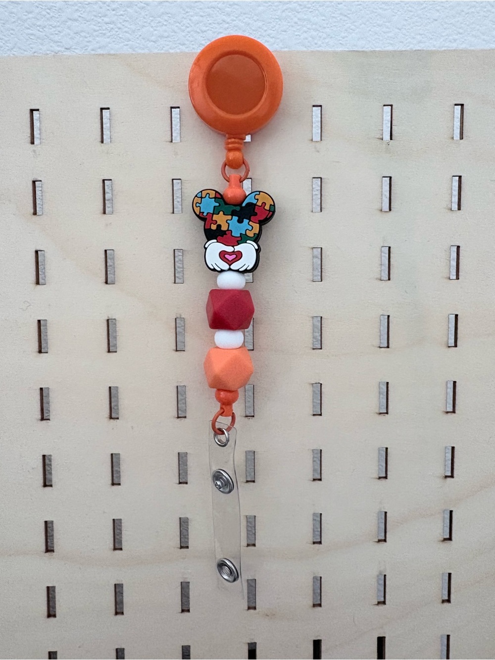 Handcrafted autism awareness theme beaded badge reel